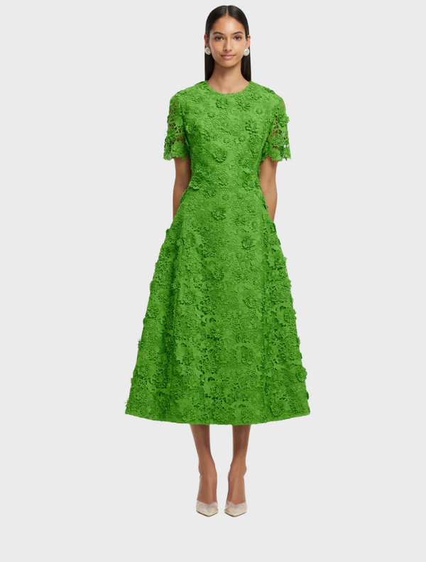 A green lace dress featuring short sleeves, elegantly designed for a stylish look.