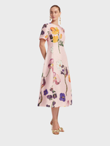 Caroline Midi Dress with short sleeves in Wildbloom pattern, highlighting a colorful floral design and elegant style.
