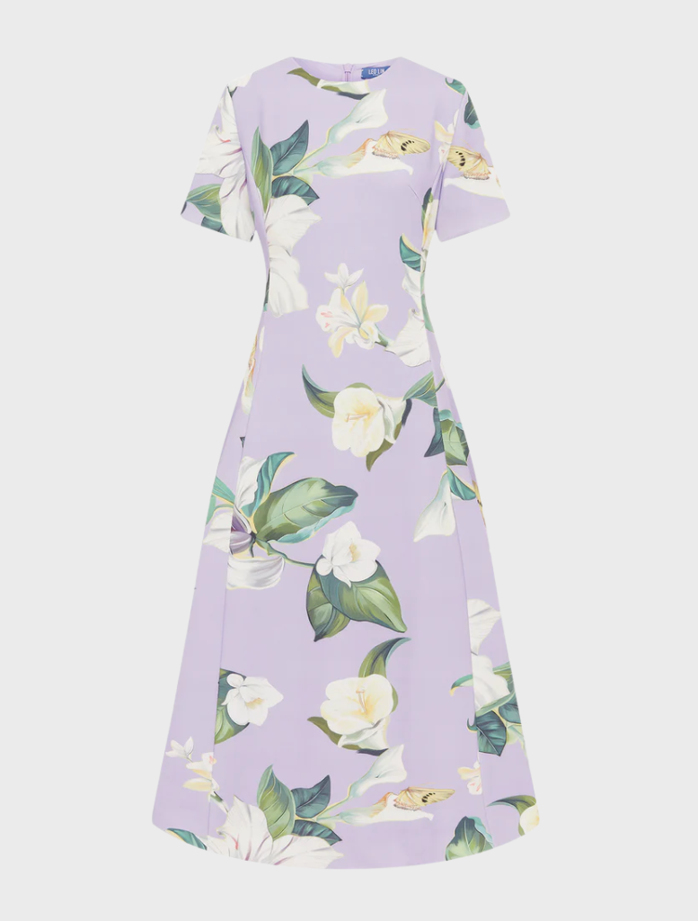  dress made from a lively floral print, featuring colorful blooms that add a fresh and vibrant touch to the garment.