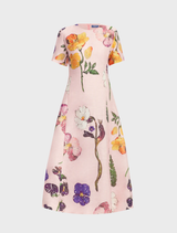 Caroline's Wildbloom Short Sleeve Midi Dress, featuring a bright floral pattern and a graceful, feminine cut.