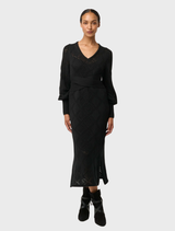 Stylish black knit dress with a V-neckline, made from a comfortable viscose cotton blend for a flattering silhouette.