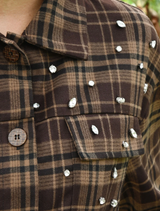 Chocolate check shacket with a classic collar and button closure, offering a chic and comfortable layering option.