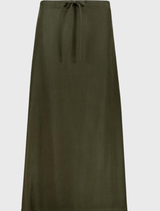 Minimalist olive modal skirt with a straight silhouette, elastic waist, and side slit, perfect for spring and summer wear.