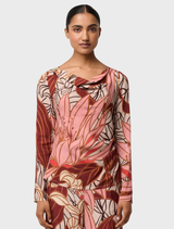 This top combines a serene gold detail with a cathedral botanic print, crafted from soft cupro viscose stretch material.