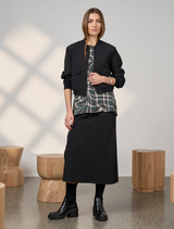 Elegant black Cavalry skirt with a structured silhouette, perfect for versatile styling options.
