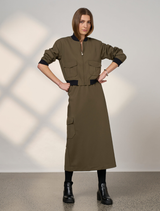 Khaki cavalry skirt displayed on a mannequin, featuring a fitted waist and flared hem for a classic silhouette.