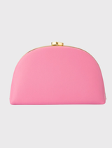 Pink Celeste Curved Clutch with a smooth leather finish, featuring a curved silhouette and optional chain handles for versatility.