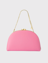 Elegant pink Celeste Curved Clutch showcasing a soft curve, leather-like finish, and options for handheld or shoulder wear.