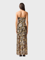 Elegant black and gold Celeste gown featuring a flowing silhouette and intricate detailing, perfect for formal occasions.
