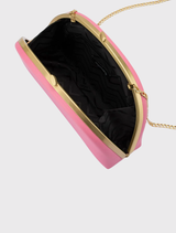 The pink Celeste Curved Clutch features a sleek design, smooth finish, and versatile carrying options for evening events.