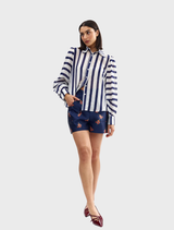 Royal stripe Celina blouse showcasing a chic design, ideal for enhancing any wardrobe with sophistication.