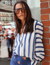 Stylish Celina blouse in royal stripes, combining comfort and elegance for versatile outfit options.