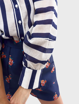 Celina blouse featuring a royal blue and white striped pattern, designed for a stylish and elegant look.
