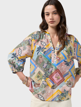 Multi-colored blouse featuring a V neckline, blouson sleeves with elastic cuffs, and custom embroidery on the placket.