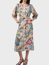 Multi-colored Ceylon Midi Dress with custom embroidery, gathered hems, and a tie belt, reflecting Sri Lanka's vibrant elegance.