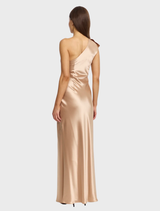Champagne Werona maxi dress hanging on a rack, highlighting its graceful lines and sophisticated style.