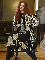 Sophisticated black dress called "Charge It To My Room," designed for versatility and chic appeal.