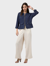 Lightweight indigo Chena jacket featuring flattering side seams and a waist tie at the folded waistband.