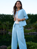 Ice blue lightweight pants featuring flattering side seams and a waist tie at the folded waistband.
