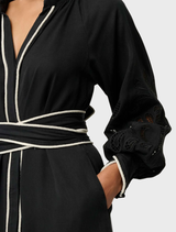 Elegant black maxi dress made of Tencel, adorned with delicate embroidery for a stylish look.