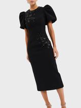 Timeless black midi dress with a refined shape and elegant drape, great for enhancing any wardrobe.