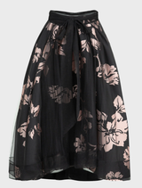 Fashionable black and pink skirt with a bow detail, designed for versatility and style in any wardrobe.