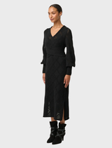 Sophisticated black knit dress featuring a V-neck, designed in a soft viscose cotton blend for comfort and style.