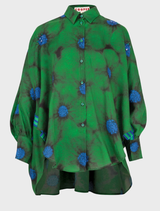 Green floral shirt with the text "Living The Dream" printed prominently on the front.