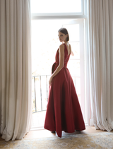 Exquisite ruby dress with a flattering shape and elegant draping, suitable for upscale events and celebrations.
