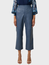 Cropped straight leg pants made of stonewashed blue leather, offering a fashionable and sleek silhouette.