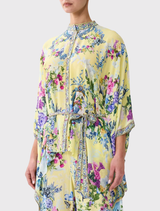 Chinoiserie-inspired silk blouse with a flowing design, batwing sleeves, and a removable belt, perfect for a chic, relaxed look.