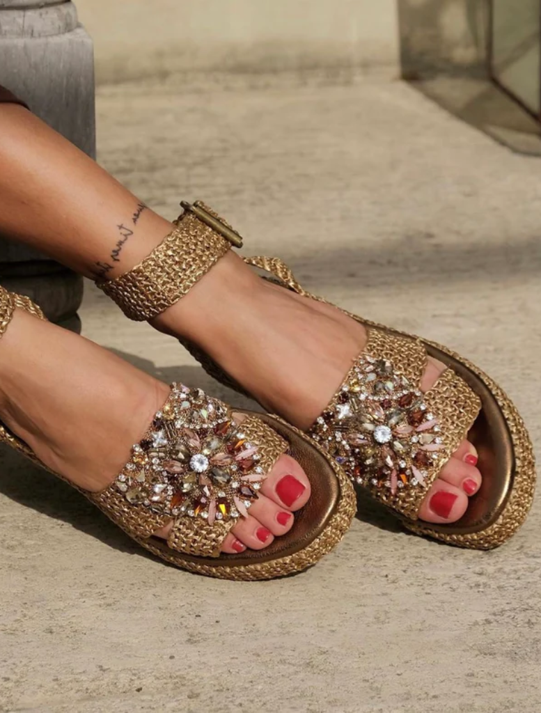 Bronzo Claire Sandal showcasing a sleek design with a supportive strap, perfect for casual or dressy occasions.
