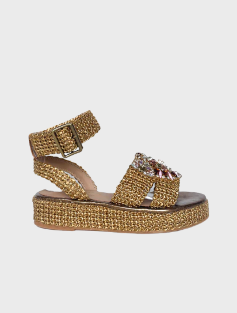 Claire Sandal in bronzo color, featuring a stylish design with a comfortable strap and a chic, modern silhouette.