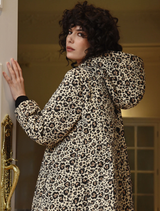 Stylish leopard print coat named "Ice To Meet You," featuring a chic design and warm fabric for cold weather.