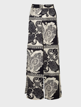 Chic black kick pleat pants, designed with a flattering fit and a distinctive pleat for a polished appearance.