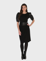 Timeless black knit skirt with a flattering fit, suitable for pairing with blouses or blazers for various occasions.