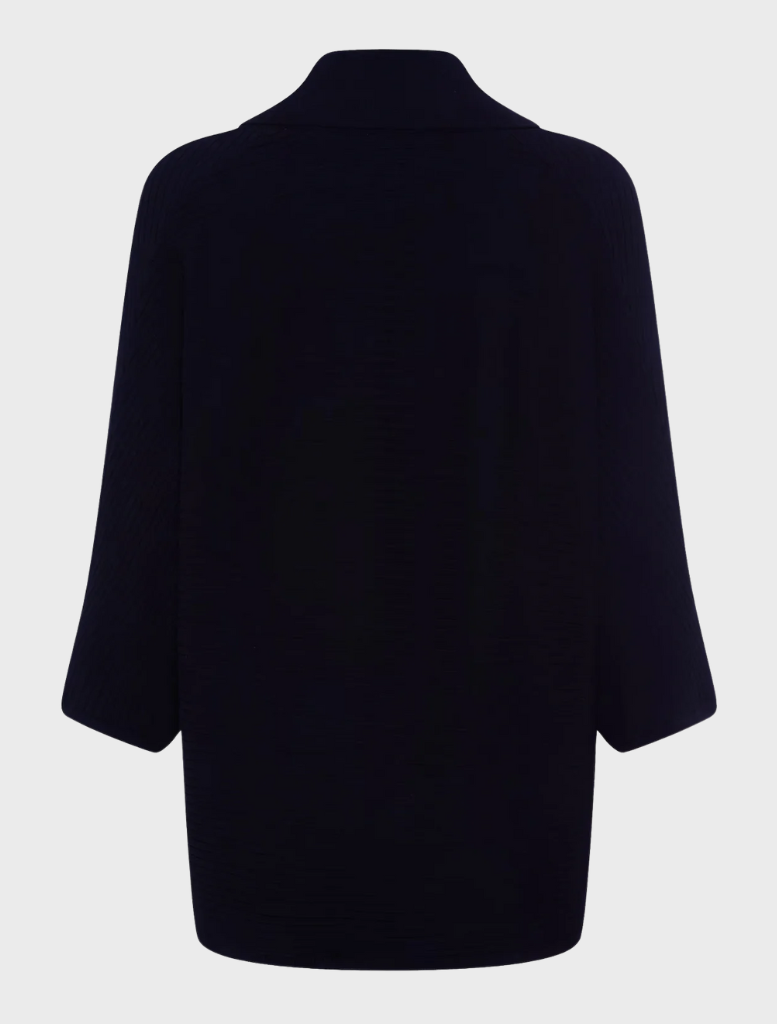A black knit cardigan, highlighting its soft texture and classic style, set against a navy backdrop.