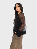 Black Pacos top on a hanger, featuring a simple yet stylish design suitable for various occasions.