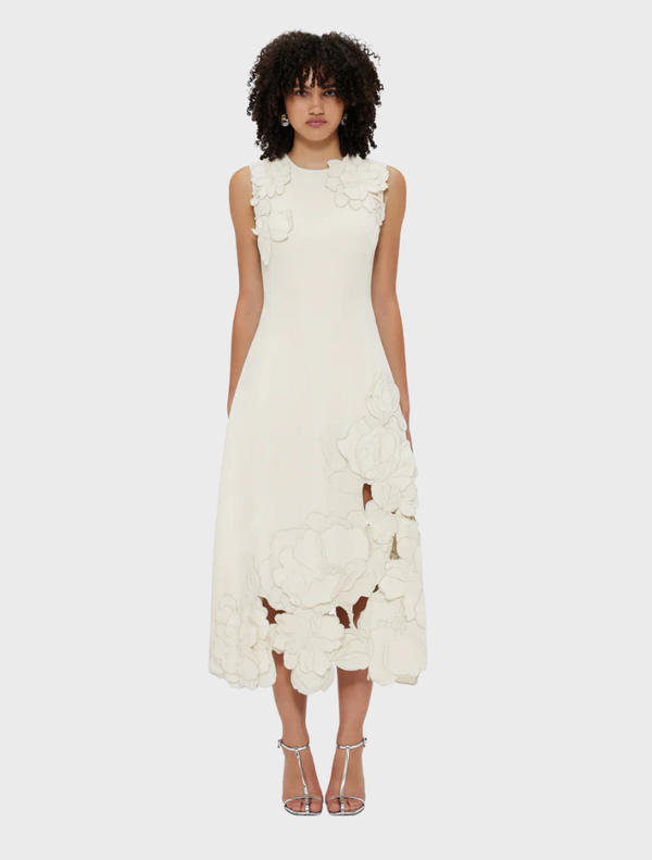 Sleeveless midi dress in vanilla with intricate appliqué detailing, perfect for warm weather occasions.