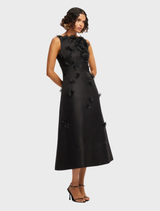 Cleo Petal's ebony sleeveless midi dress showcases a chic design, perfect for formal or casual occasions.