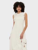 Feminine vanilla midi dress with a sleeveless cut and lovely appliqué embellishments, great for warm days.
