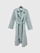 A stylish coat named Noor, featuring a modern design and elegant fabric, suitable for various occasions.