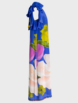 Modern Romance Dress featuring a cobalt background adorned with vibrant, colorful floral patterns.