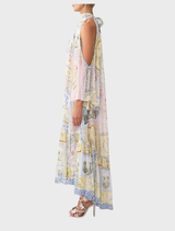 Cold shoulder long dress showcasing a beautiful botanical print, designed for sophistication and comfort in warm weather.