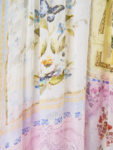 Elegant cold shoulder long dress adorned with a vibrant botanical pattern, ideal for formal events and summer gatherings.