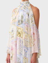  Cold shoulder long dress featuring a botanical print, perfect for elegant occasions and showcasing a stylish silhouette.