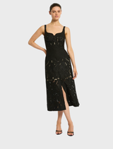 Elegant black Colette dress featuring a fitted silhouette and delicate detailing, perfect for formal occasions.