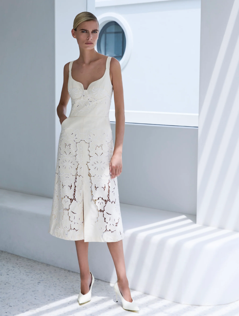 Colette Dress in Buttermilk color, featuring a flowing design and elegant silhouette suitable for various occasions.