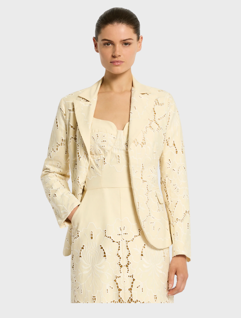 Elegant Colette Jacket in a soft buttermilk hue, perfect for layering in any season.