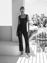 Black Colette Pant draped elegantly, emphasizing its modern style and versatile design